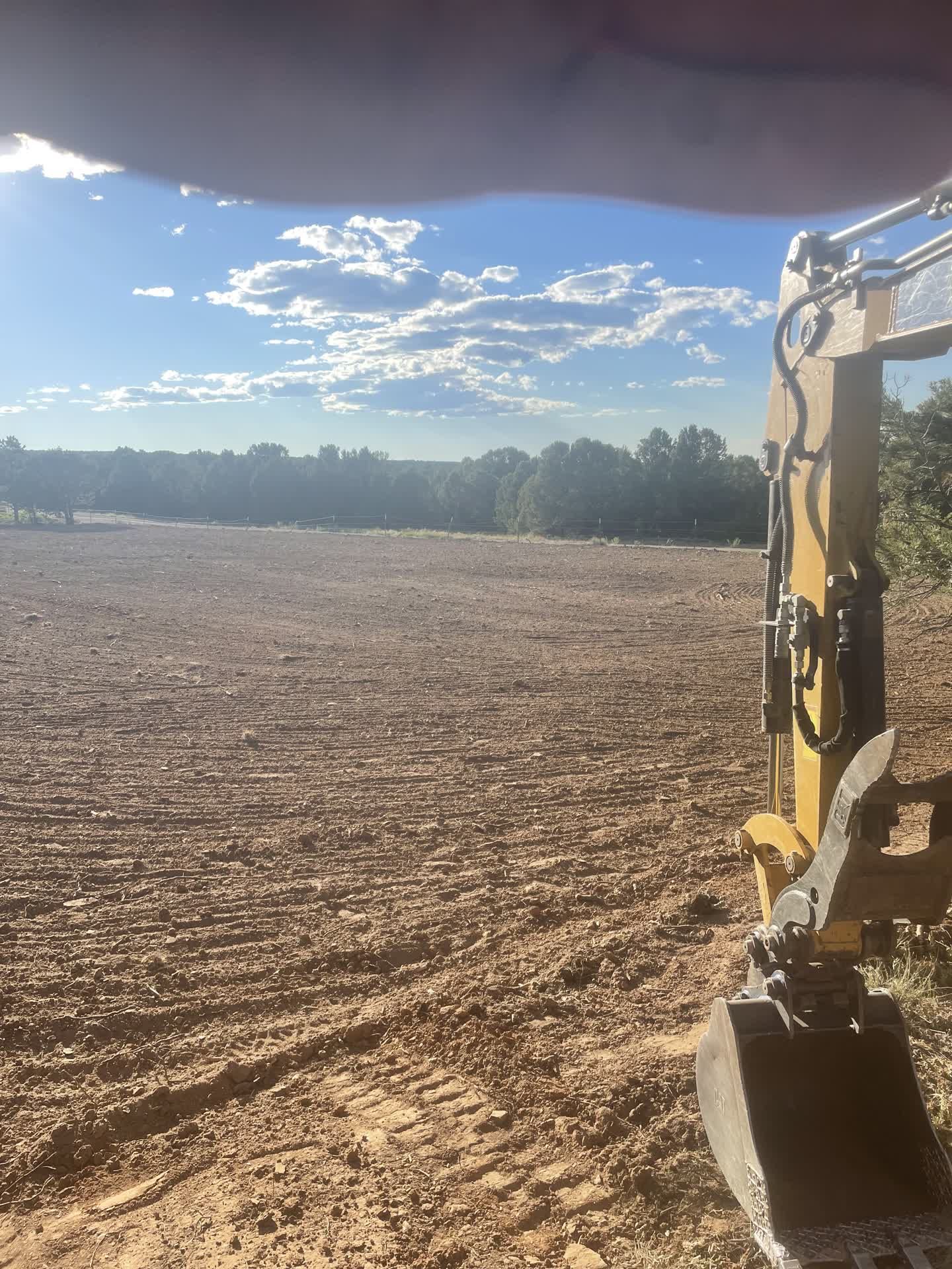 Land clearing project with flattened field